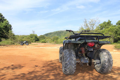 Tractor on field against sky