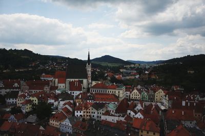 High angle view of buildings in town against sky