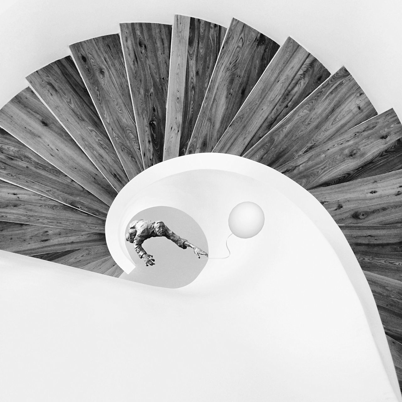 circle, low angle view, geometric shape, directly above, high angle view, still life, shape, close-up, indoors, single object, pattern, spiral, white color, no people, directly below, design, built structure, day, architecture, wood - material