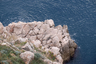 High angle view of rocks on shore