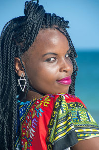 Close-up portrait of young woman at beach