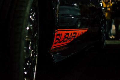 Close-up of text on car windshield at night