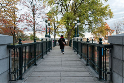 Man walking on footbridge