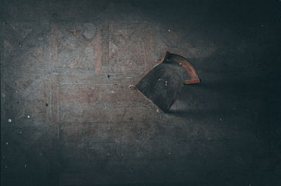 Close-up of rusty metal hanging on wall