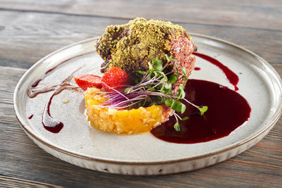 High angle view of fruits in plate on table