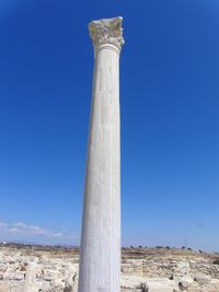 Low angle view of historical building against blue sky