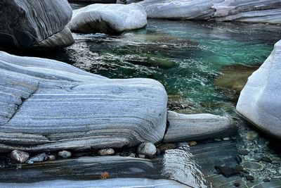 High angle view of rocks in river during winter