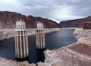 Scenic view of reservoir of hoover dam against cloudy sky