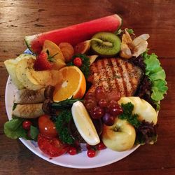 High angle view of fruits in plate on table