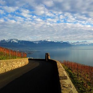 Empty road leading towards mountains