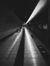 Illuminated tunnel at night