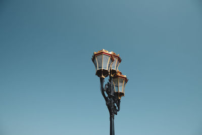 Low angle view of street light against clear sky