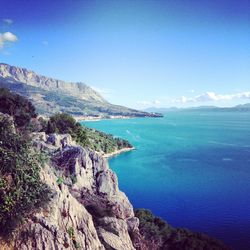 Scenic view of sea against blue sky