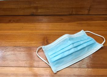 High angle view of blue umbrella on wooden table