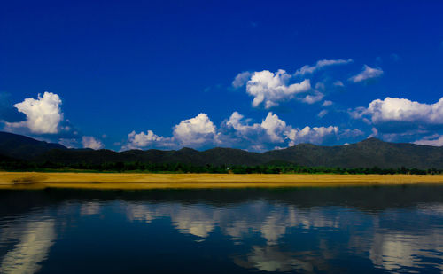 Scenic view of lake against blue sky