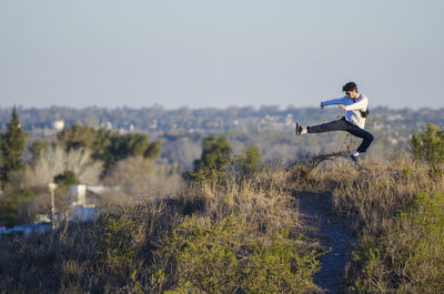 Full length of man jumping on land