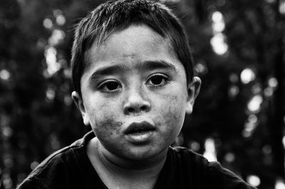 Close-up portrait of messy boy