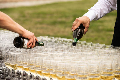 Cropped hand of man working at table