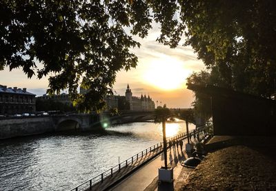 Bridge over river at sunset