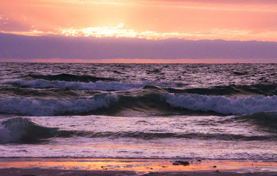 Scenic view of sea at sunset