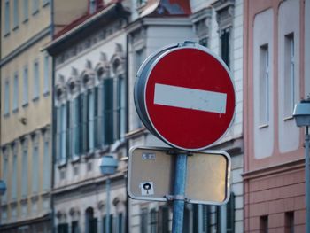 Close-up of road sign in city