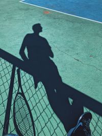 High angle view of person shadow on floor