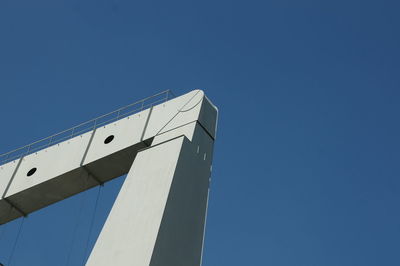 High section of built structure against clear blue sky