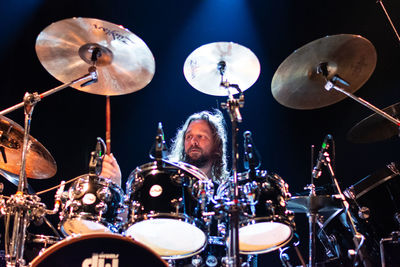 Low angle view of man playing at music concert