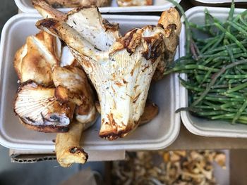 High angle view of fresh mushrooms in container at store