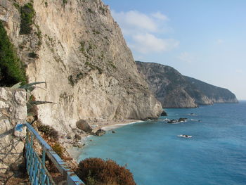 Scenic view of sea and mountains against sky