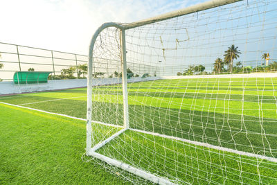 Scenic view of soccer field against sky