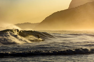 Surfing at sunset