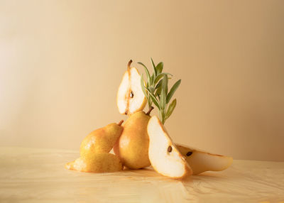 Composition of pears and sprigs of sage on a beige background. creative fruit food concept.