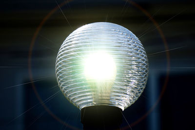 Low angle view of illuminated light bulb