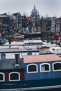 View of buildings in city during winter