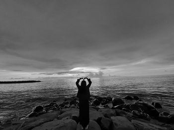 Man on beach against sky