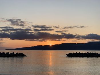 Scenic view of sea against sky during sunrise