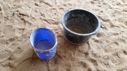 High angle view of blue tea on sand