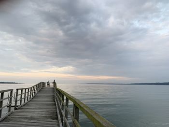 Pier over sea against sky