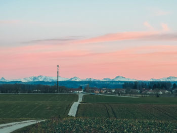 Scenic view of field against sky during sunset