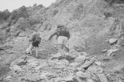 Rear view of people on rock