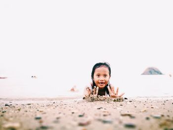 Portrait of happy boy on beach