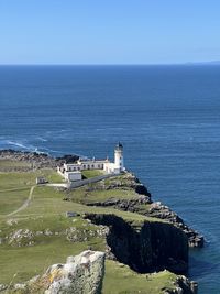 Scenic view of sea against clear blue sky