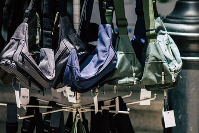 Close-up of shoes hanging in row