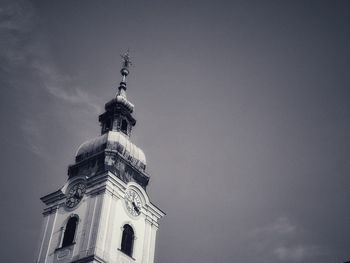 Low angle view of bell tower against sky