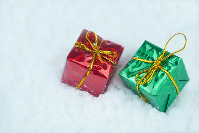 High angle view of gift box on snow