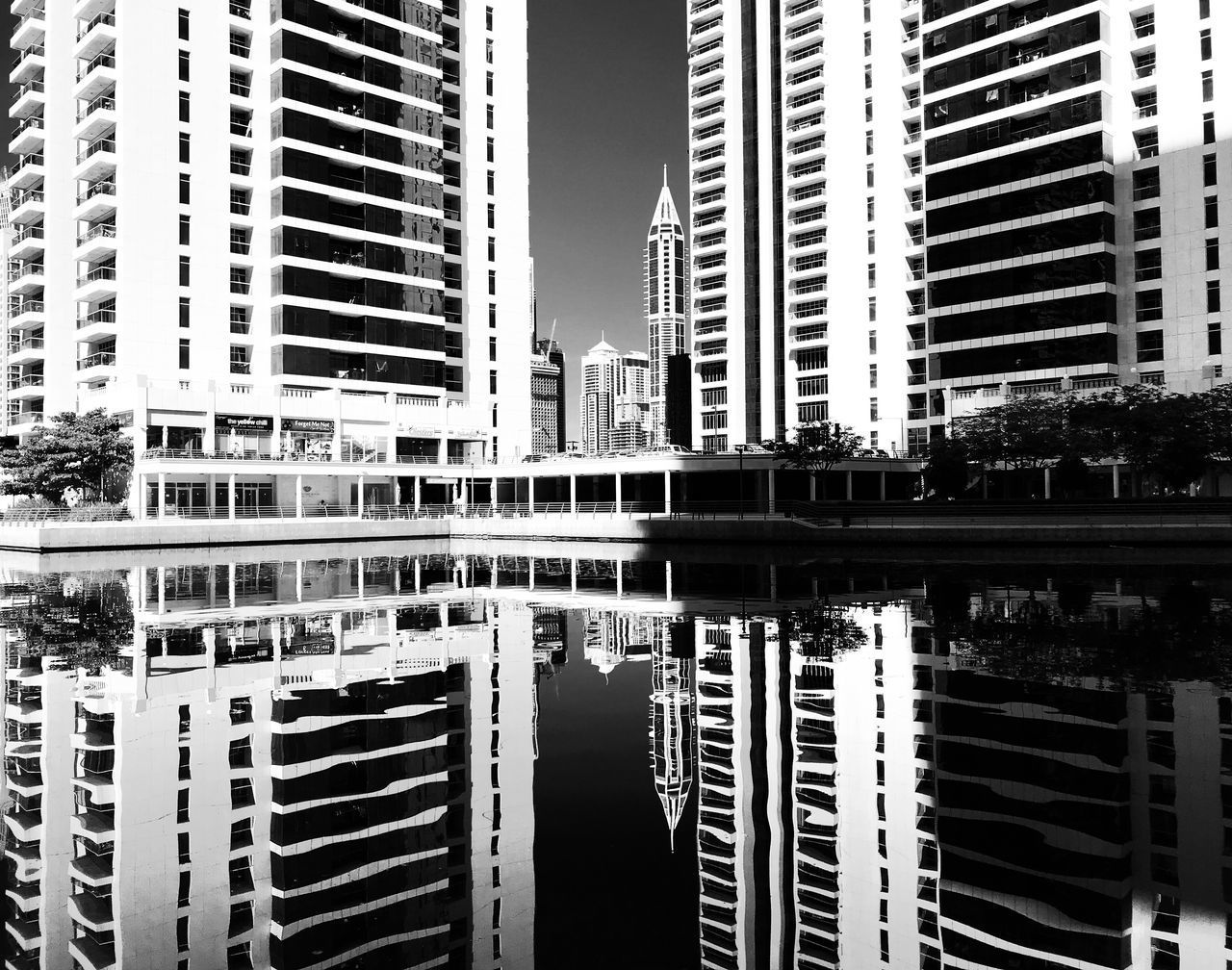 REFLECTION OF SKYSCRAPERS IN CITY