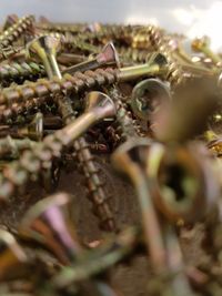 Close-up of rusty metal on field