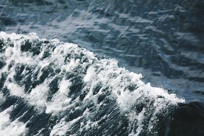 High angle view of waves splashing in sea