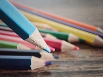 Close-up of colored pencils on table